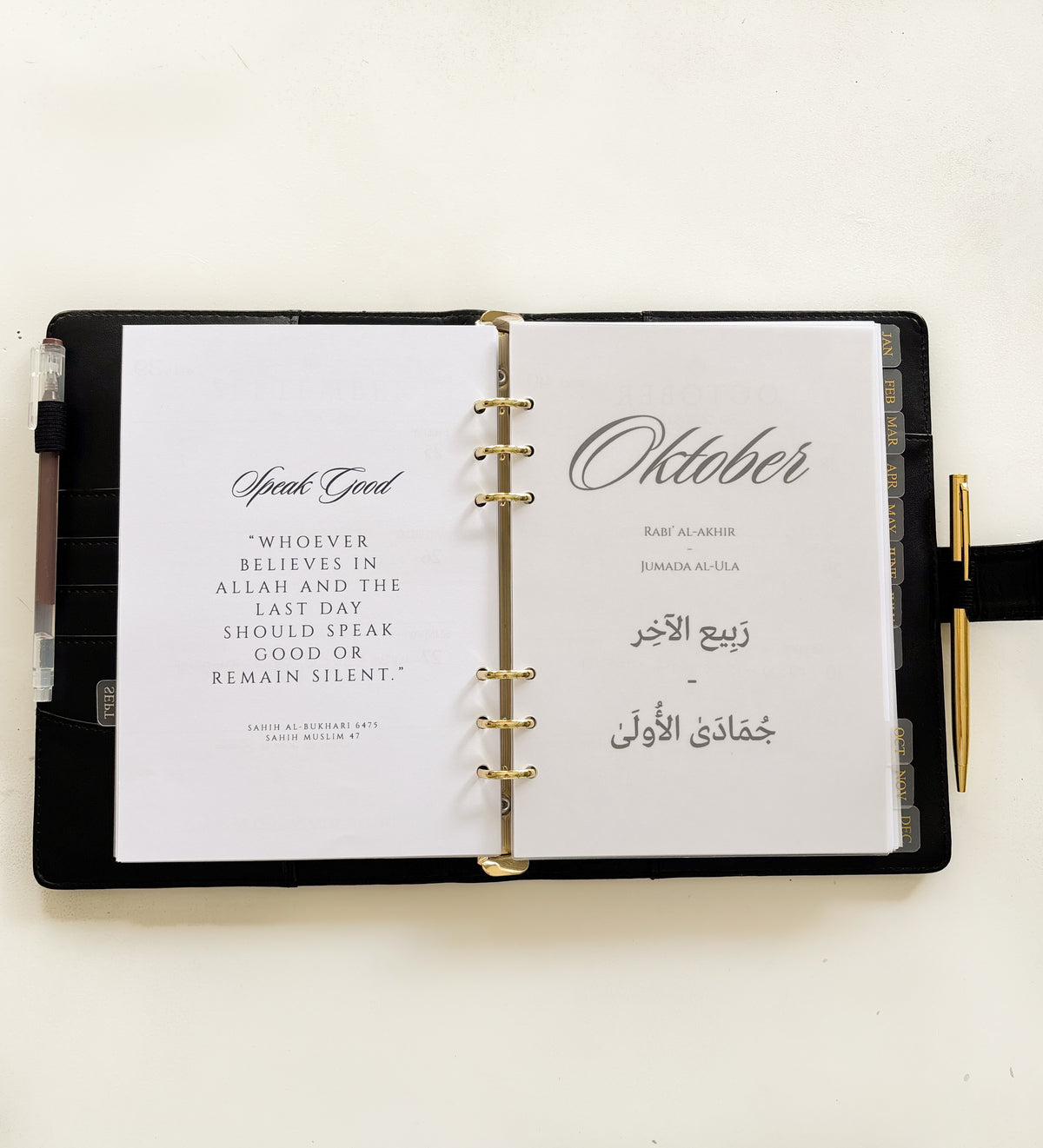 Monthly dividers inserted in a planner binder for easy organization
