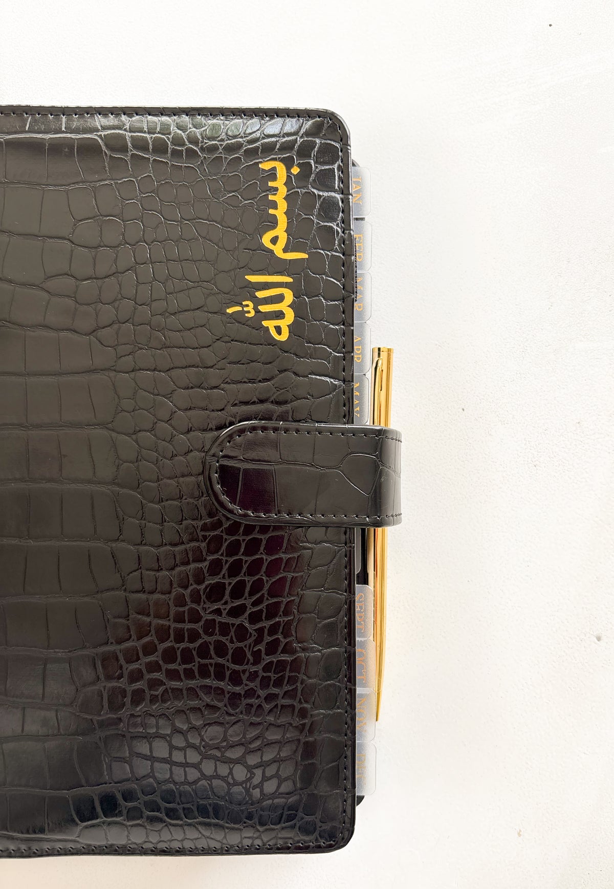 Monthly dividers inserted in a planner binder for easy organization
